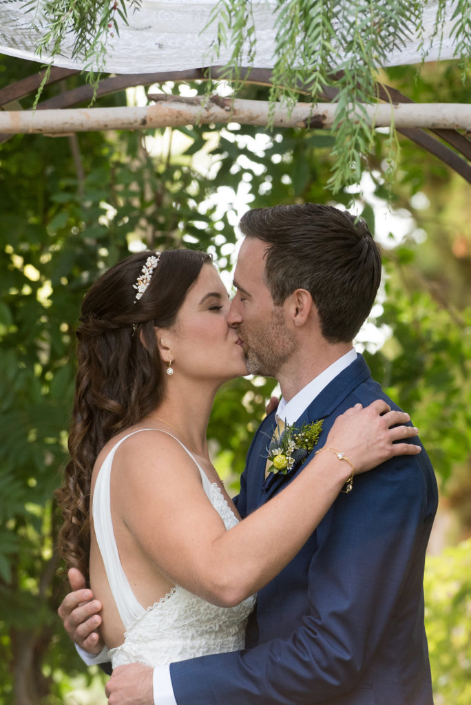 bride and groom's first kiss 