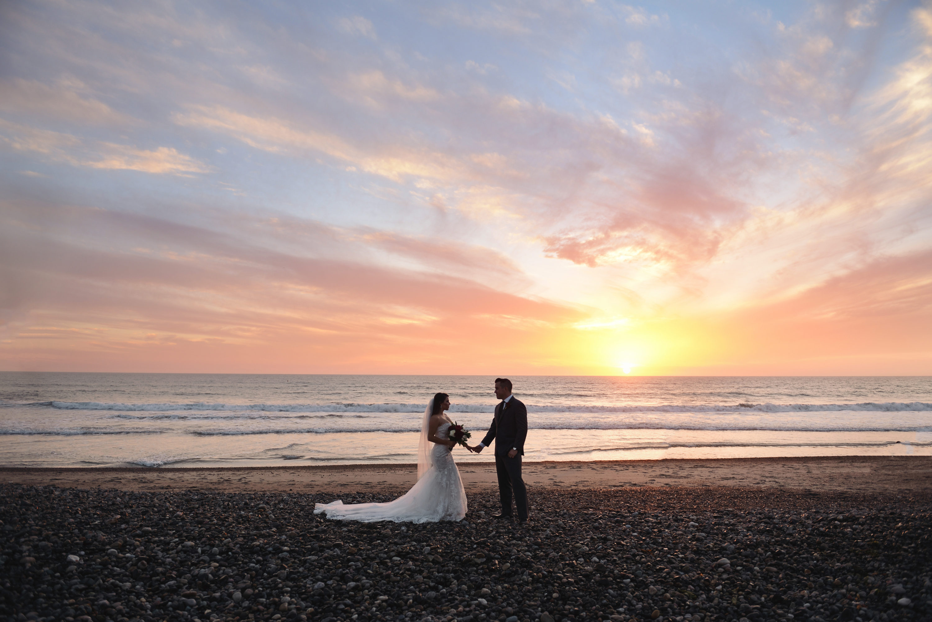 bride and groom on beach, wedding sunset beach photo