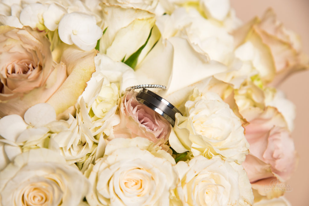 ivory wedding flowers, wedding rings with bouqet