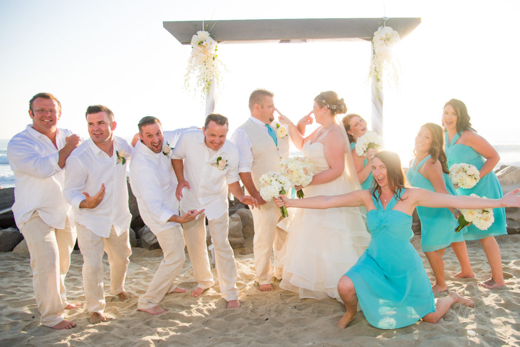 beach wedding, bridal party goofing off
