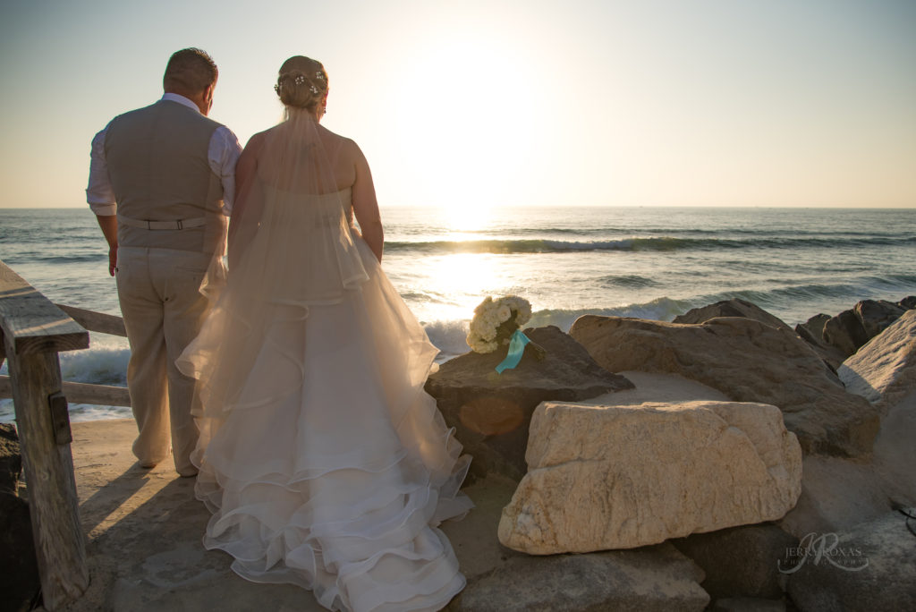bride and groom sunset beach photo